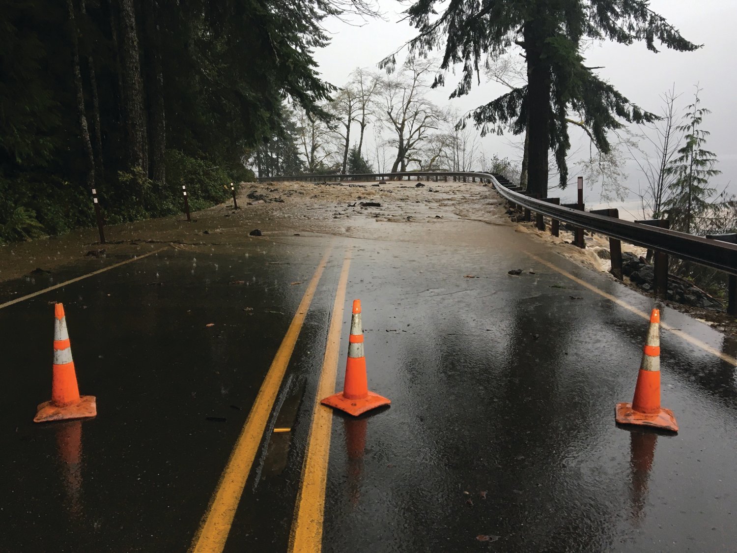 Cones are placed to block off US Highway 101 around Lake Crescent.